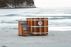 Wooden hot tub on a snowy beach with a blurred background sulis hot tub